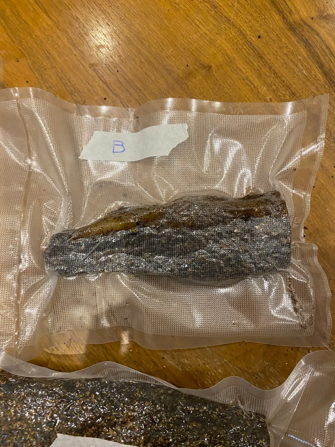 Vacuum-packed biltong with a handwritten B label