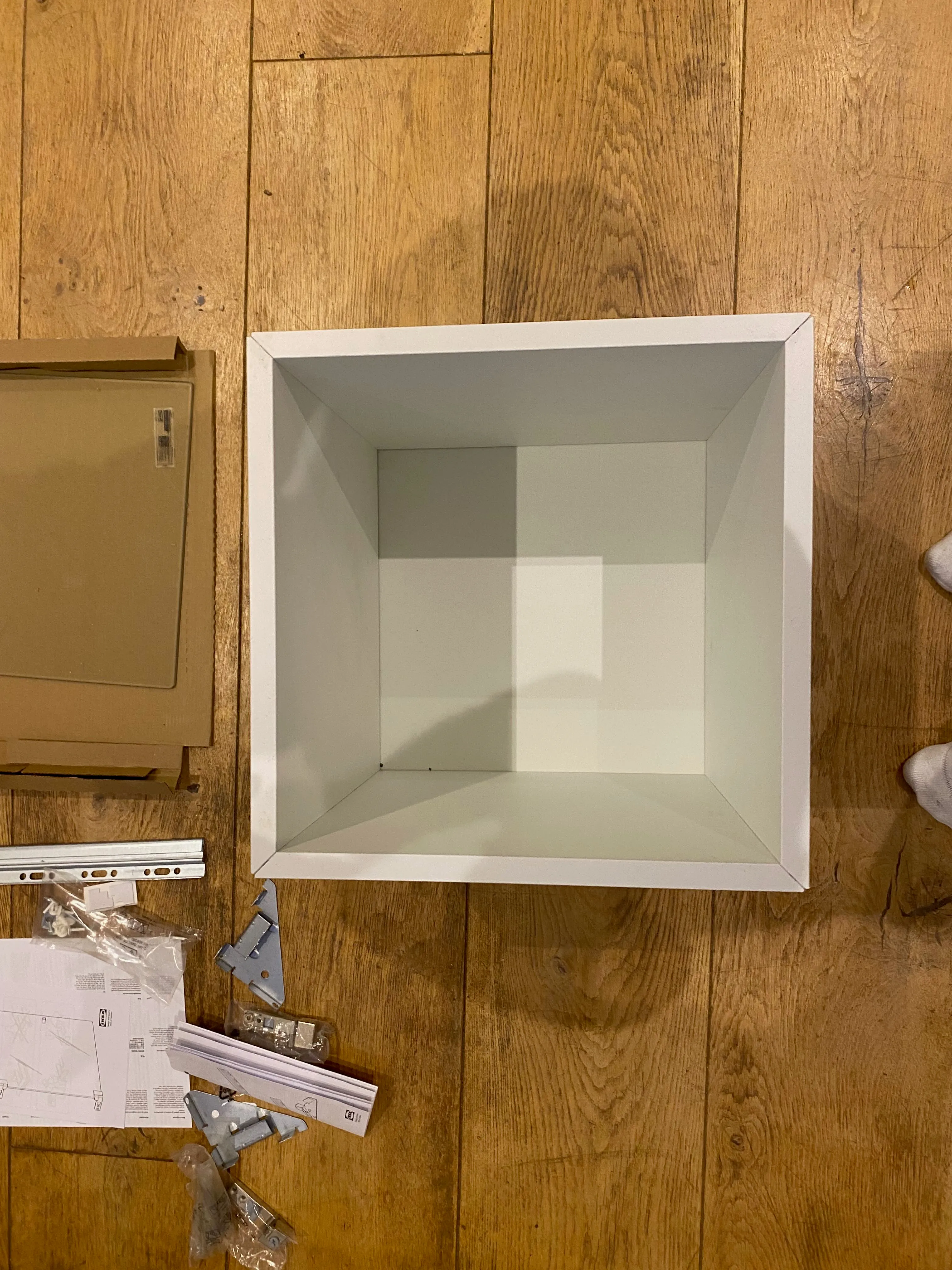 The assembled EKET cabinet interior — a clean white cube ready for modification